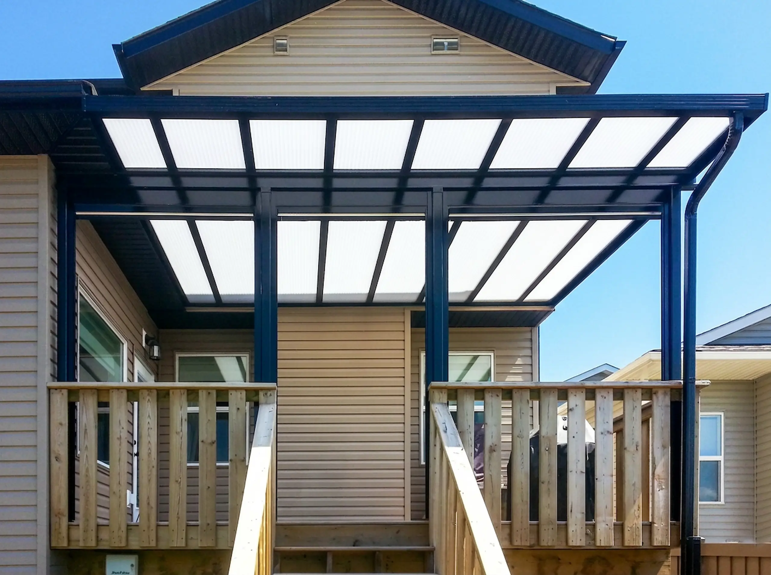 Acrylic patio cover providing shade on a Georgia home.