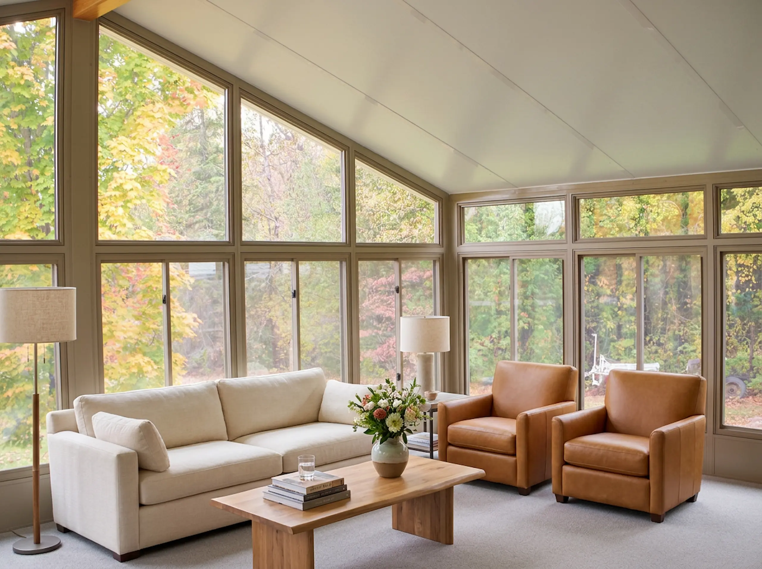 Glass sunroom extending outdoor living through fall in Atlanta.